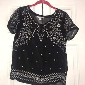 American Eagle black shirt with white design.